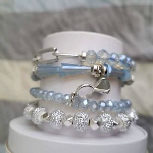 Rhodium/light blue crystal brackets...